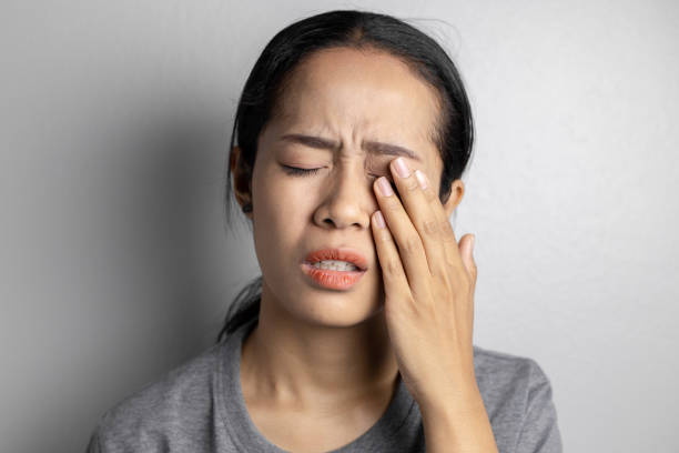 istock Woman suffering from strong eye pain. 1151963790