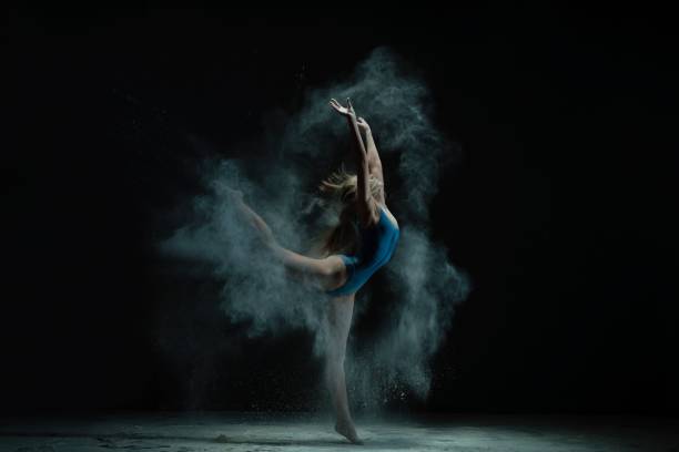istock Woman in white dust cloud profile shot 1151965853
