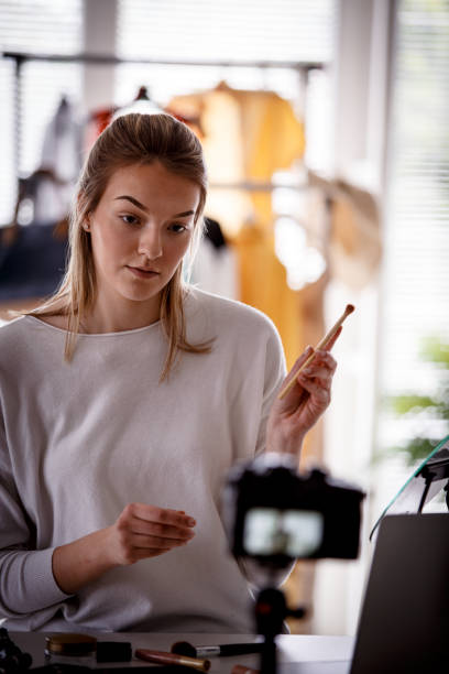 istock Woman making a video for her blog about makeup 1151965965