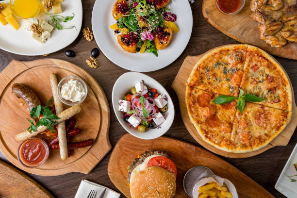 istock Assorted sausages, Burger with meat, Pizza, fried chicken top view 1151967001