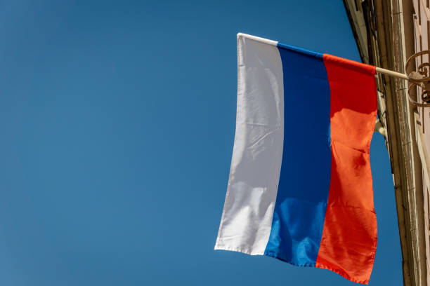 istock Russian flag against the blue sky. 1151967490