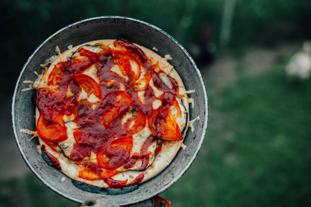 istock rustic pizza with tomatoes and ketchup on the nature outside 1151969023