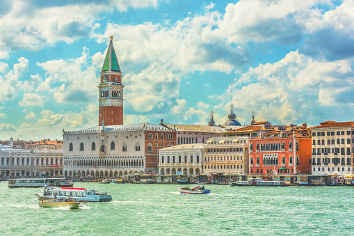Riva degli Schiavoni - view Venetian Lagoon with docked gondolas.