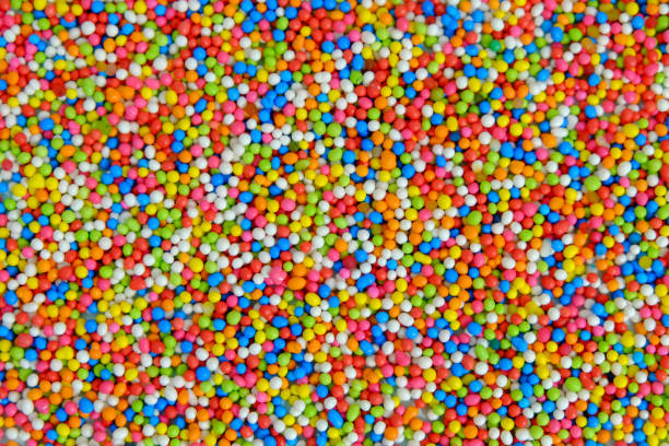 istock Rainbow sprinkle sugar background, Multicolor sugar texture wallpaper, Sugar for cake decorate 1151969378