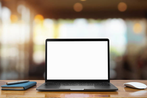 istock laptop computer blank white screen and pen on table in cafe background 1151970260
