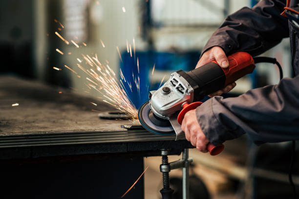 istock Cutting metal with grinding machine, close-up. 1151972883