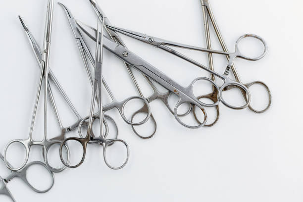 istock surgical instruments on white isolated background. top view 1151974916
