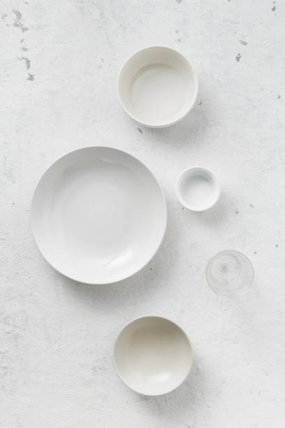istock Set of empty plates on white background top view 1151978483