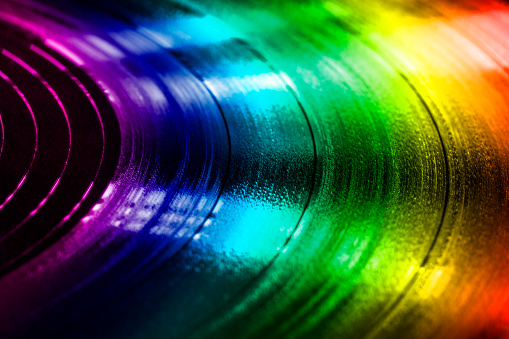 Colorful surface of an old vinyl record. Macro shot, shallow depth of field.