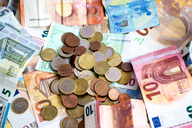 istock stack of euro banknotes and coins of different denominations 1151979768