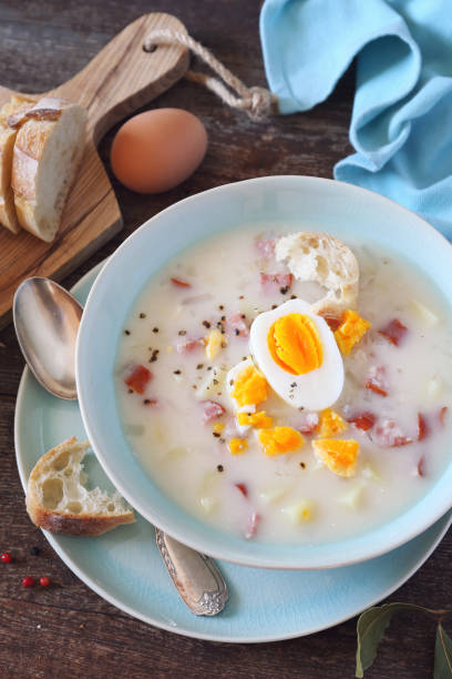 istock Zurek. Sour soup with sausage,  potatoes and eggs 1151980054