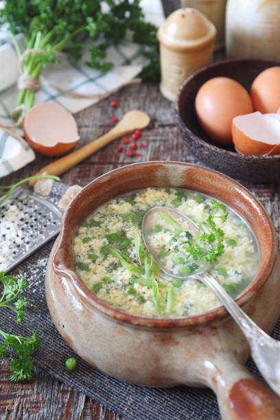istock Green pea stracciatella soup: parsley, eggs and parmesan cheese 1151980186