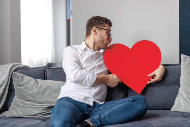 istock Funny man kissing big heart 1151982095