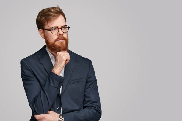 istock Thoughtful businessman looking away 1151982126