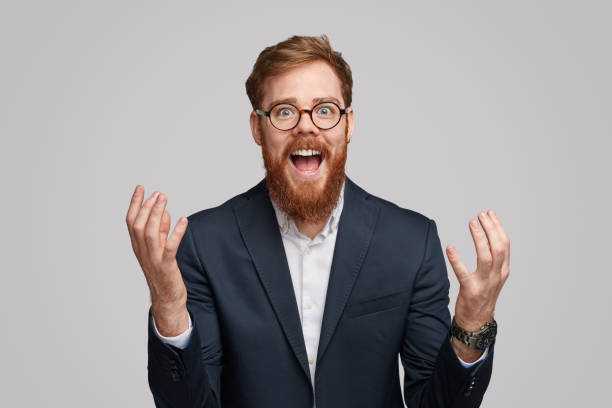 istock Red bearded businessman screaming in excitement 1151982128