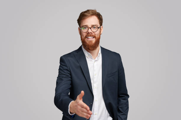 istock Cheerful businessman offering hand for handshake 1151982150