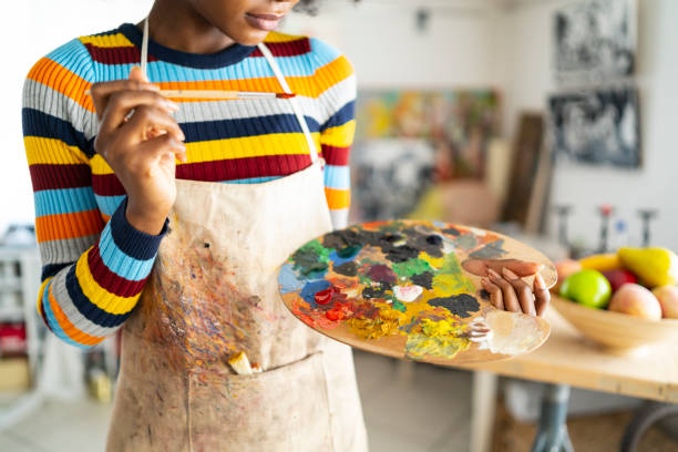 istock Female artist working in studio 1151982218