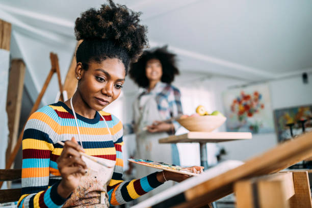 istock Female fine artists drawing in studio 1151982222