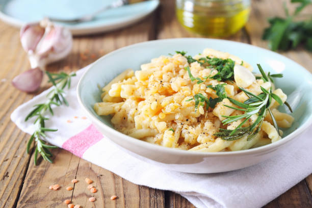 istock Italian cuisine. Penne pasta with red lentils 1151982448