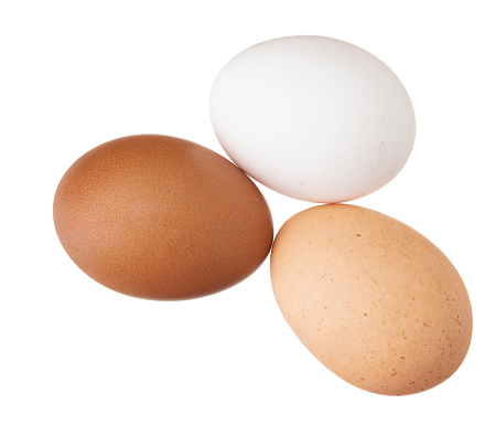 Group of white raw eggs, one is broken.