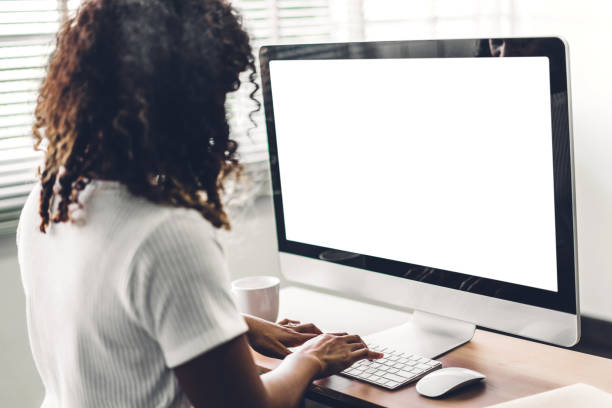 istock African american black woman using computer with white mockup blank screens in modern work loft 1151986942