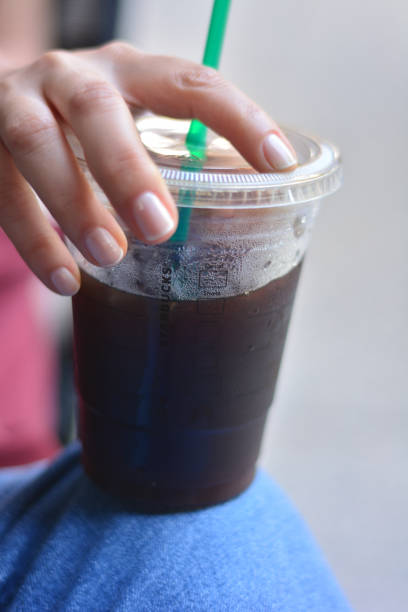 istock Woman Holding an Ice Coffee Plastic Glass 1151988830