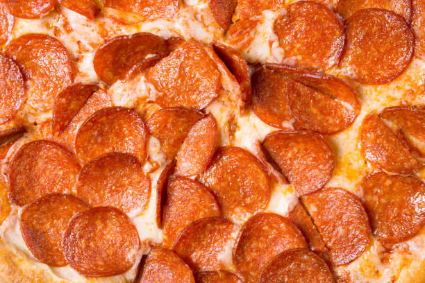 istock Fresh tasty pepperoni pizza as a background. Pizza close up. 1151991437