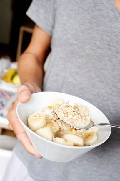 istock young man eating some porridge 1151991850