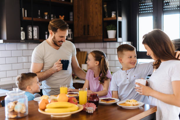 istock Family with three children having breakfast at home 1151992012