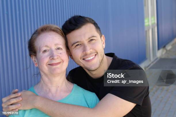 Woman In Her Sixties With Man In His Twenties Stock Photo - Download Image Now - Confidence, Mother, Senior Adult