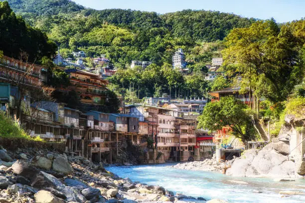 River in the center Wulai village , Taiwan. It is a popular spa near Taipei. Many tourists come here to take a bath in warm springs.