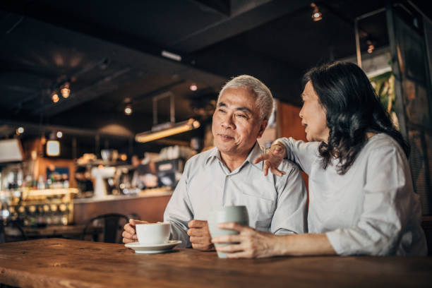 istock Happy friends drinking coffee in cafe 1151996846