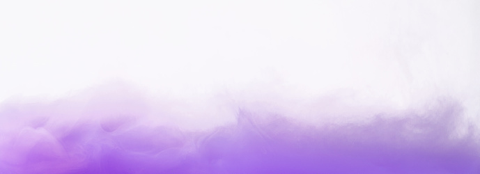 Colored smoke swirling underwater on white background, copy space. Lavander mist concept, panorama