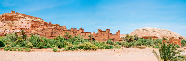 Morocco, Panorama of Ait Ben Haddou ighrem (fortified village) on a sunny day with clear blue sky on the background. Fortified village (castle) Ait Ben Haddou on a sunny day with clear blue sky on the background. ksar stock pictures, royalty-free photos & images