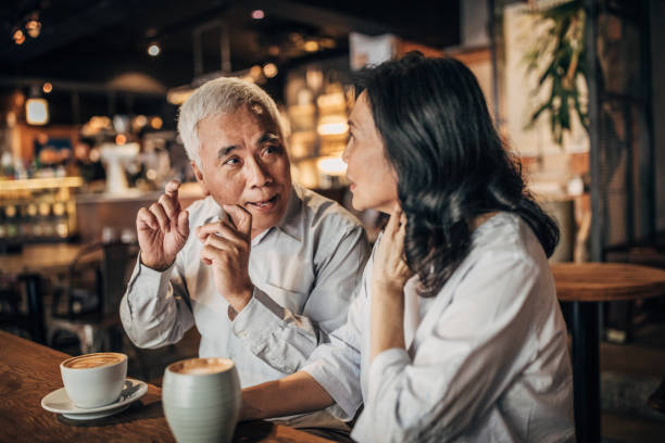 istock Friends drinking coffee in cafe 1151998184