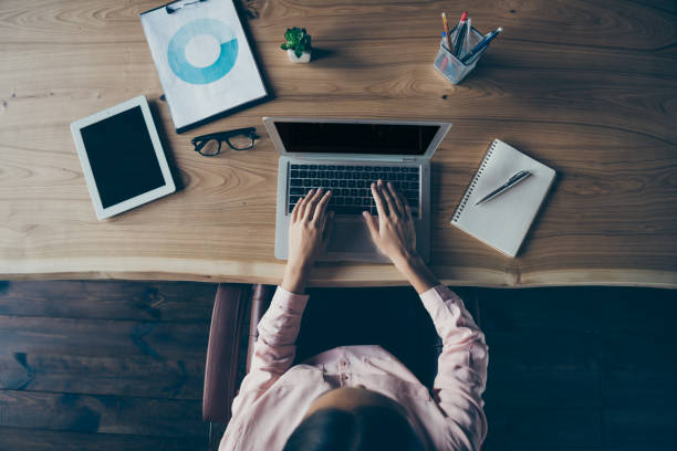istock Top above high angle cropped view of nice confident smart lady skilled experienced specialist shark ceo boss chief typing email letter at modern industrial loft interior style work place station 1152002031