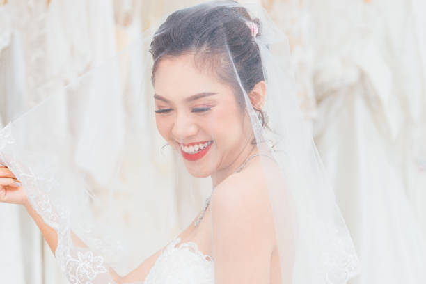 istock Thai Bride Girl Smiling while attached vail with head 1152002545