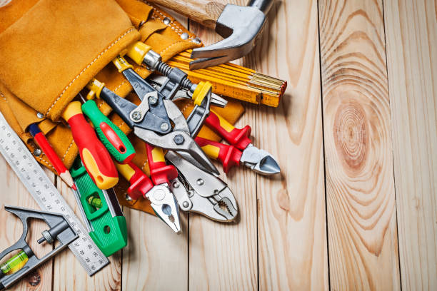 istock set of tools  in toolbelt on wooden background 1152003404