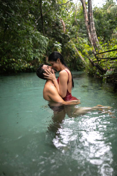 istock Couple embracing in Waterfall in Tocantins, Brazil 1152003633