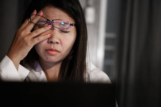 istock Asian woman suffering from eye strain tired from overwork on computer screen 1152009909