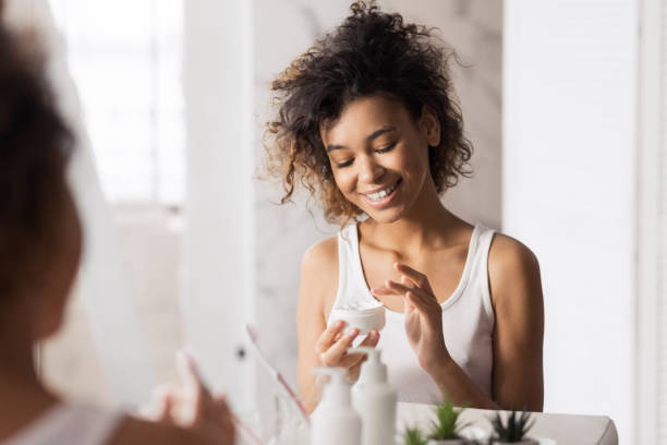 istock Beautiful afro woman in bathroom 1152011593