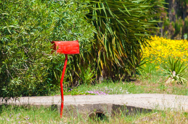 istock Red mailbox in a country road 1152013895