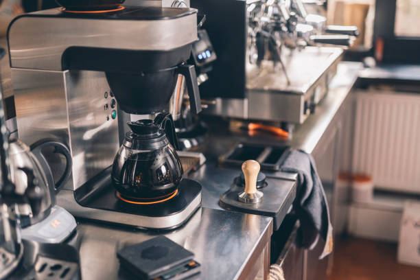 istock Glass coffee jug standing in the coffee machine 1152014220