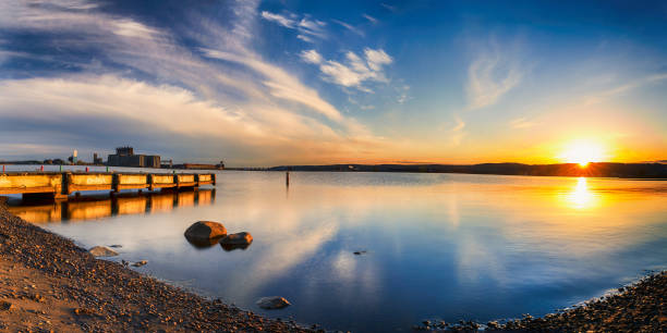 istock Beautiful sunset over St Louis River, Duluth, Minnesota with fishing dock and reflection 1152014377