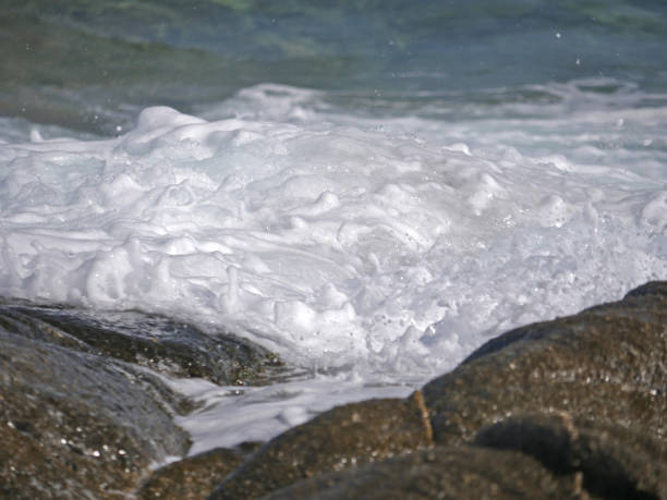 istock Waves crashing against the rock 1152015392