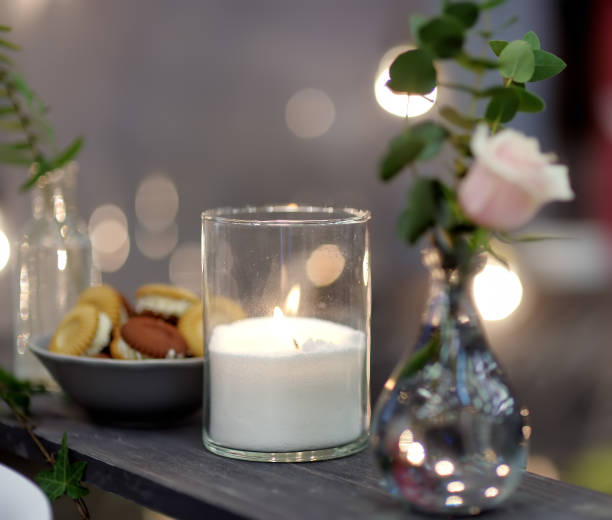 istock Table set for an event party or wedding reception in rustic or scandinavian style decorated moss and fern. Fashionable table set. 1152016098
