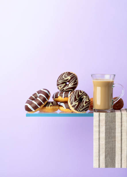istock Chocolate donuts and latte on a black background. 1152016469