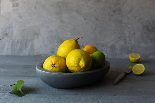 istock Still life with fresh yellow lemons in a bowl 1152017053