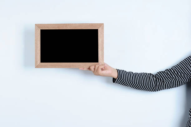 istock Asian woman hands holding blackboard 1152017506