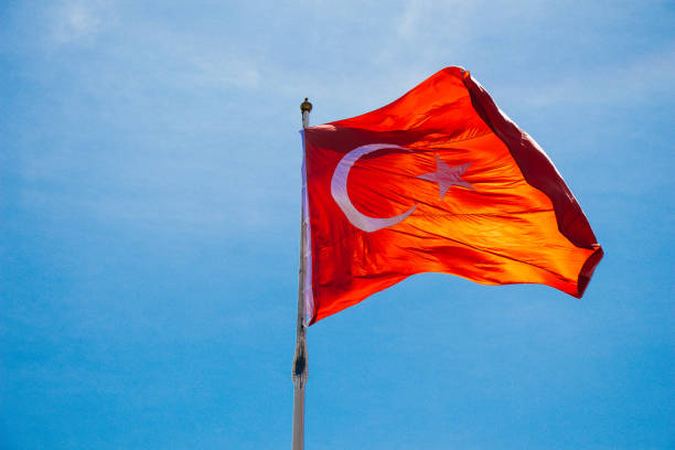 istock Turkish national flag with white star and moon in sky 1152017689